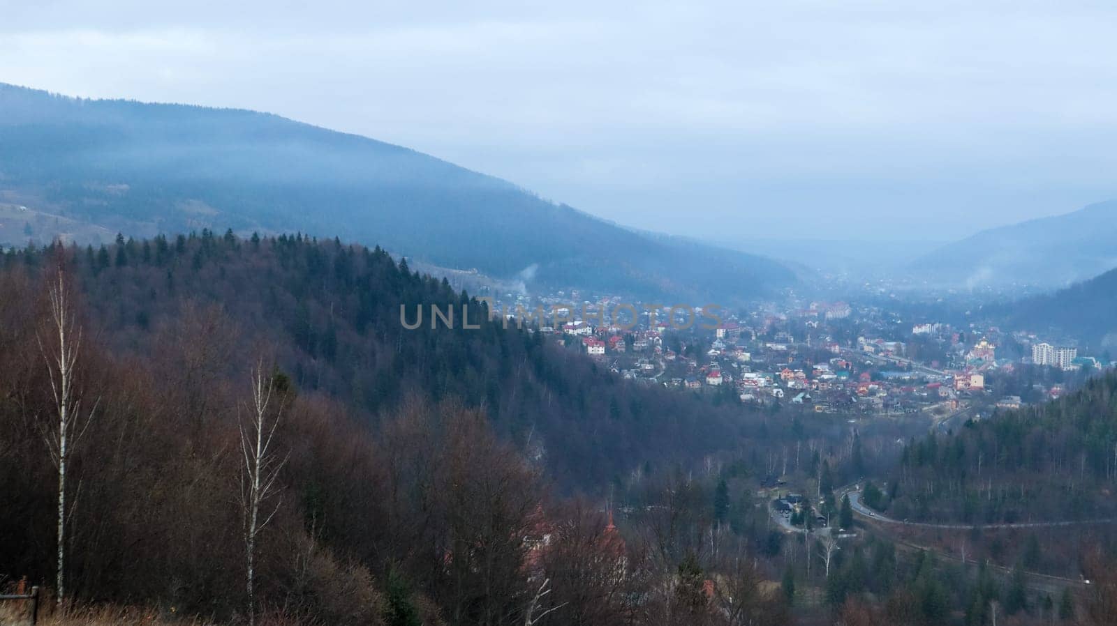 Colorful autumn landscape in a mountain village. Misty morning in the Carpathians. Ukraine, Europe. Beautiful hills and houses. World of beauty. Mountain view in the fall. Beautiful natural landscape
