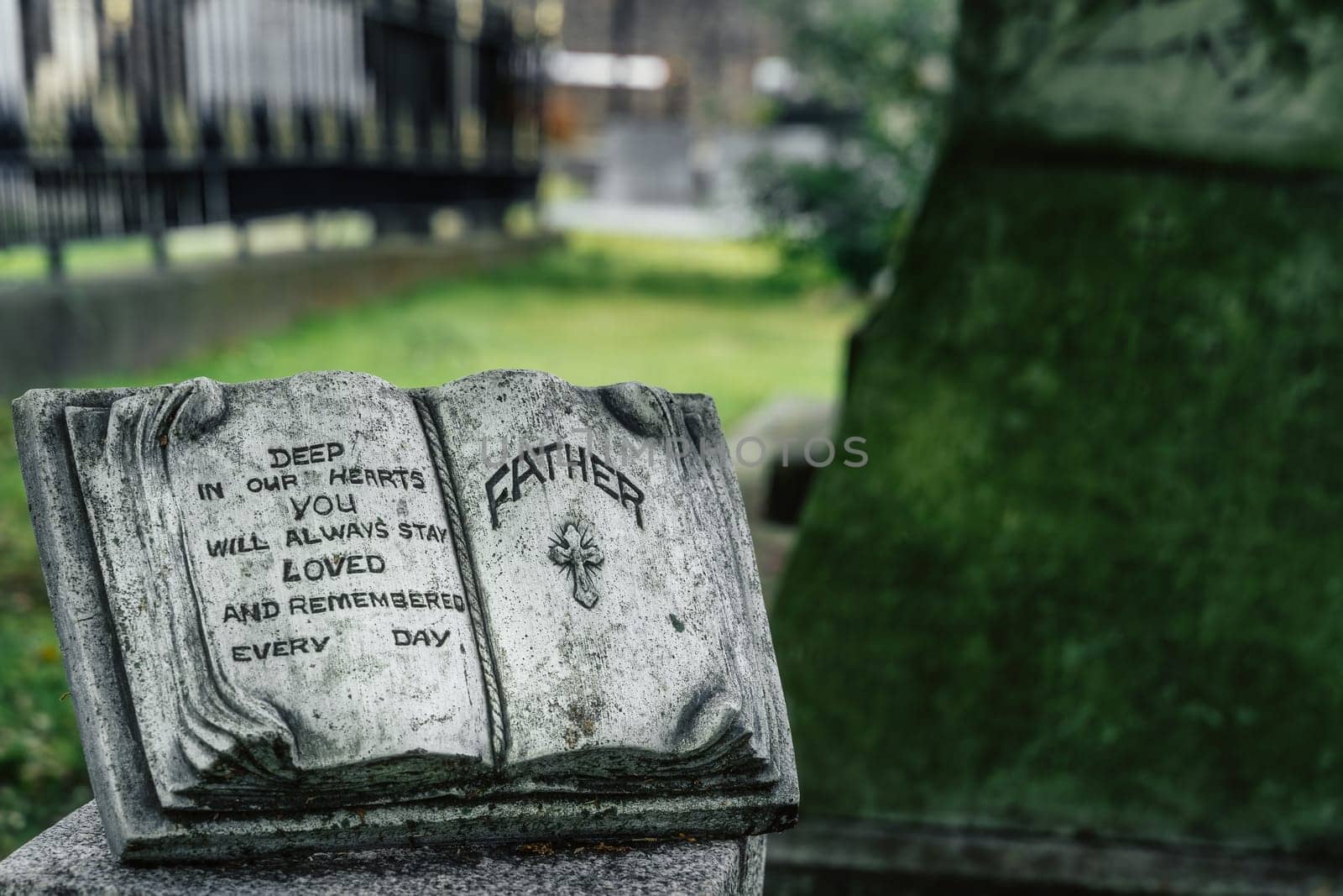 Dublin, Ireland, August 2019 Sculpture of an open book as a memorial for the father in Glasnevin Cemetery