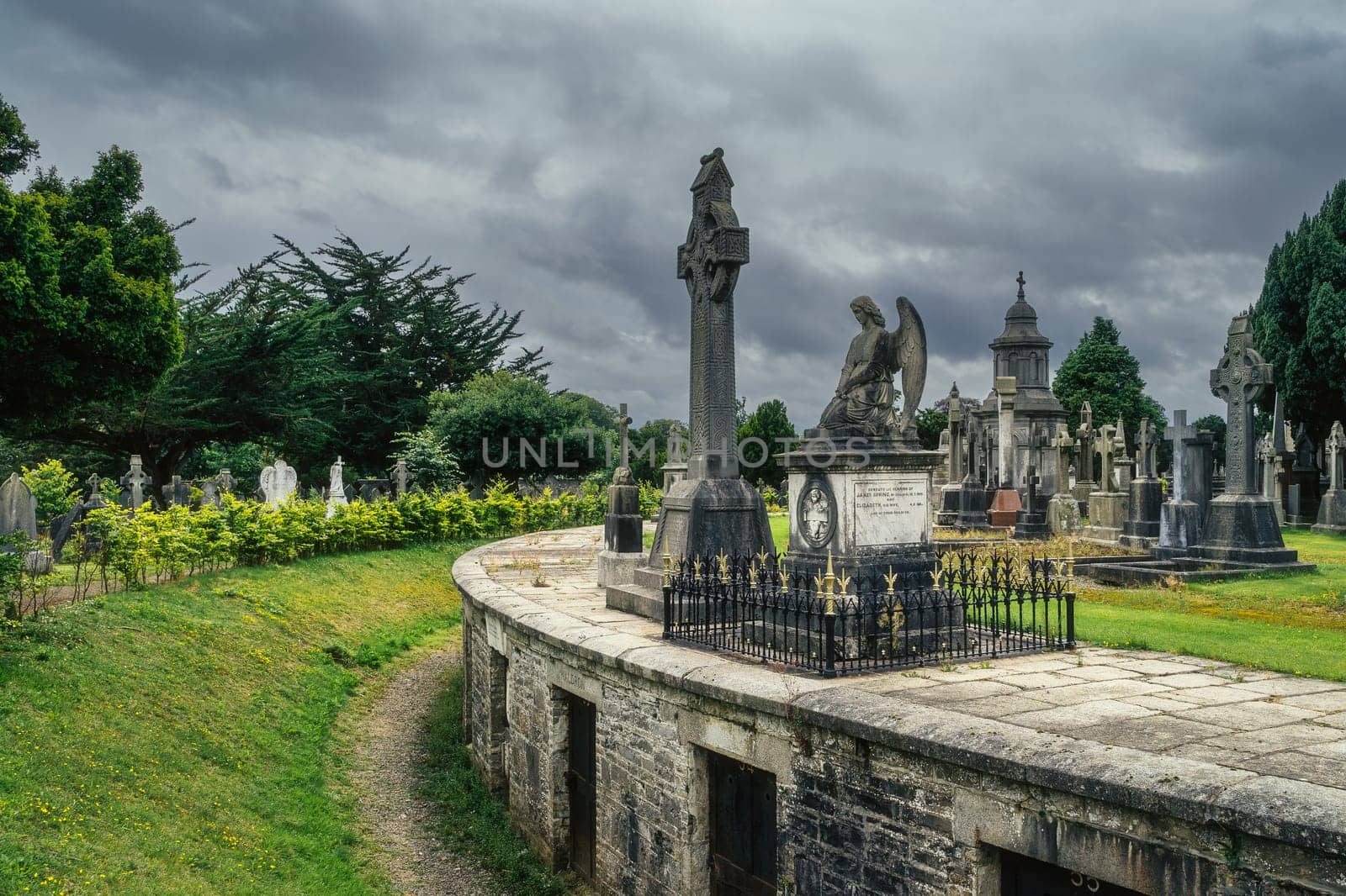 Dublin, Ireland, August 2019 Round mausoleum or crypts with ancient graves and tombstones in Glasnevin Cemetery