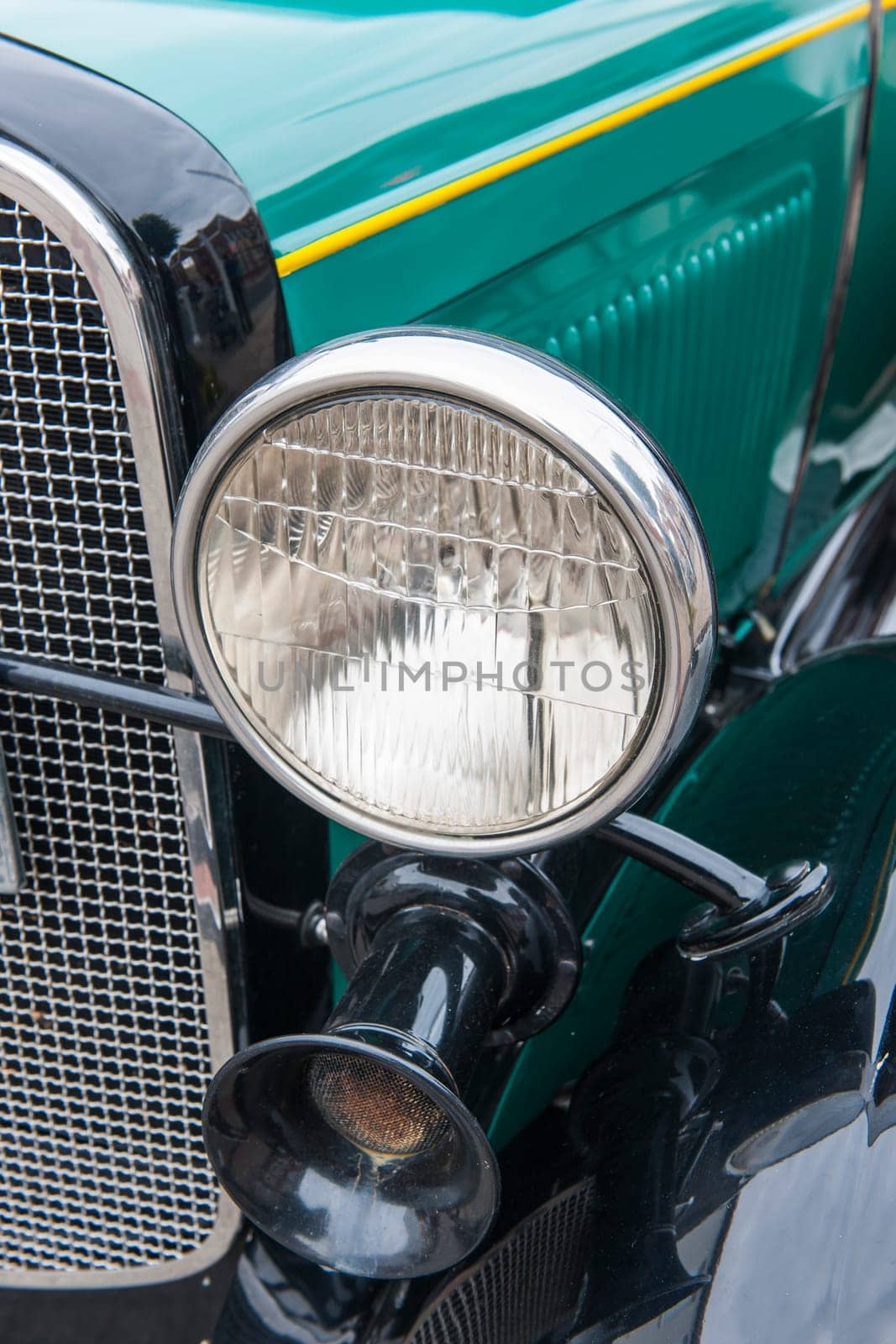 Esens, Germany - September 19, 2021: Reflection of a German classic car in the hubcap of another classic car at the classic car meeting in Esens.
