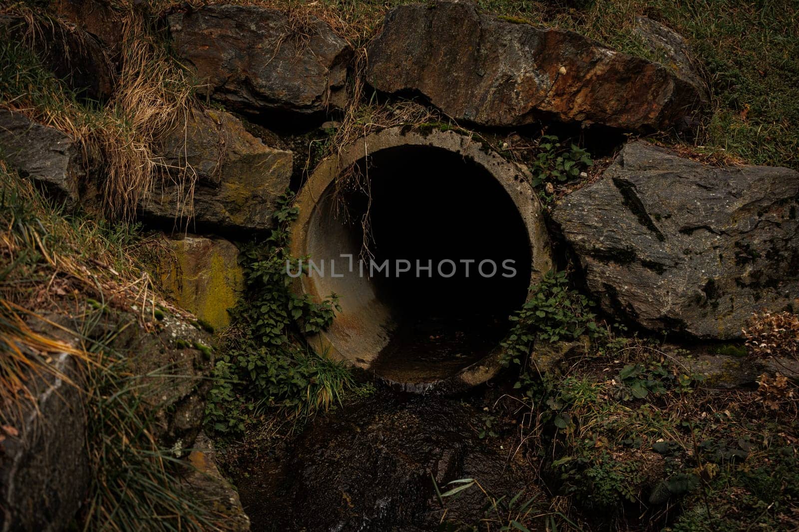 Dark pipe in brick wall