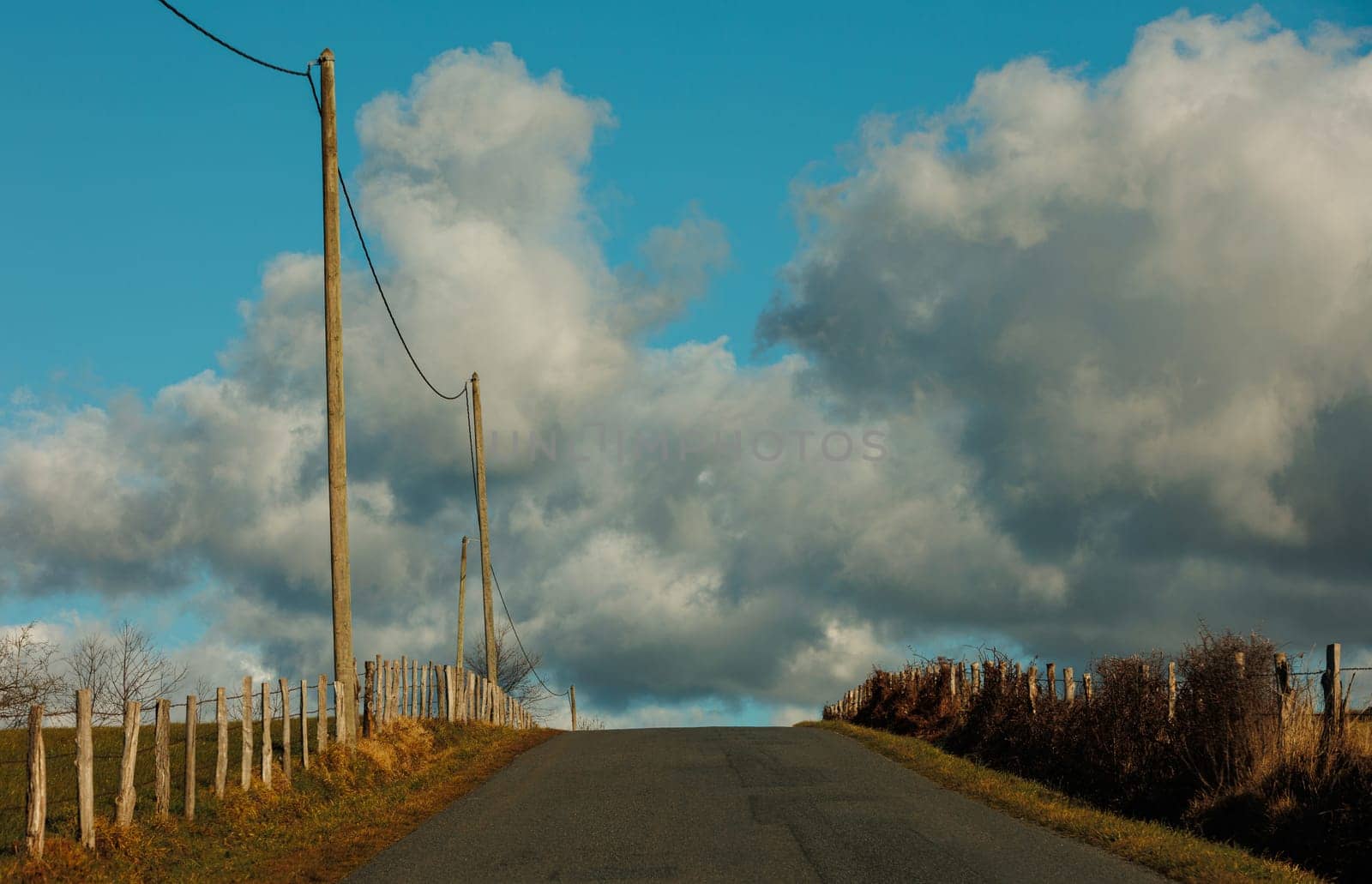 road into sky with clouds