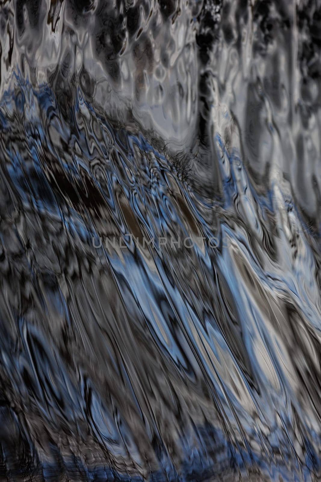 Flowing silver water texture of a river