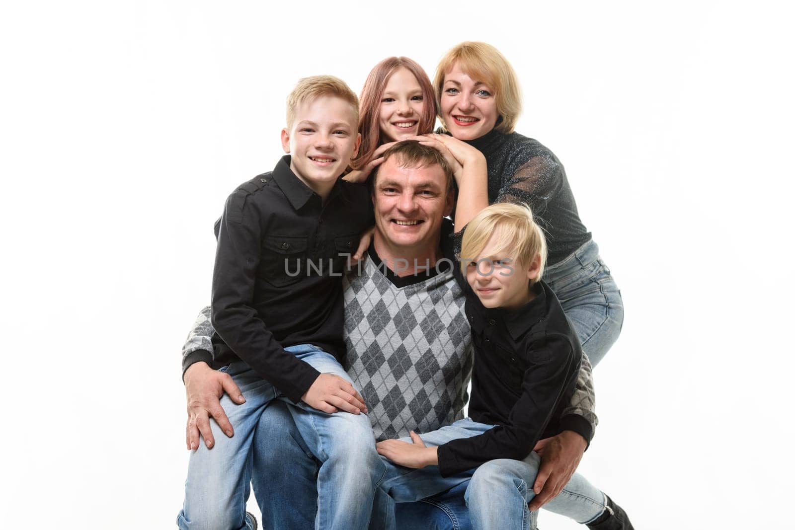 Children and mom hug happy dad, portrait of large adult family, isolated on white background