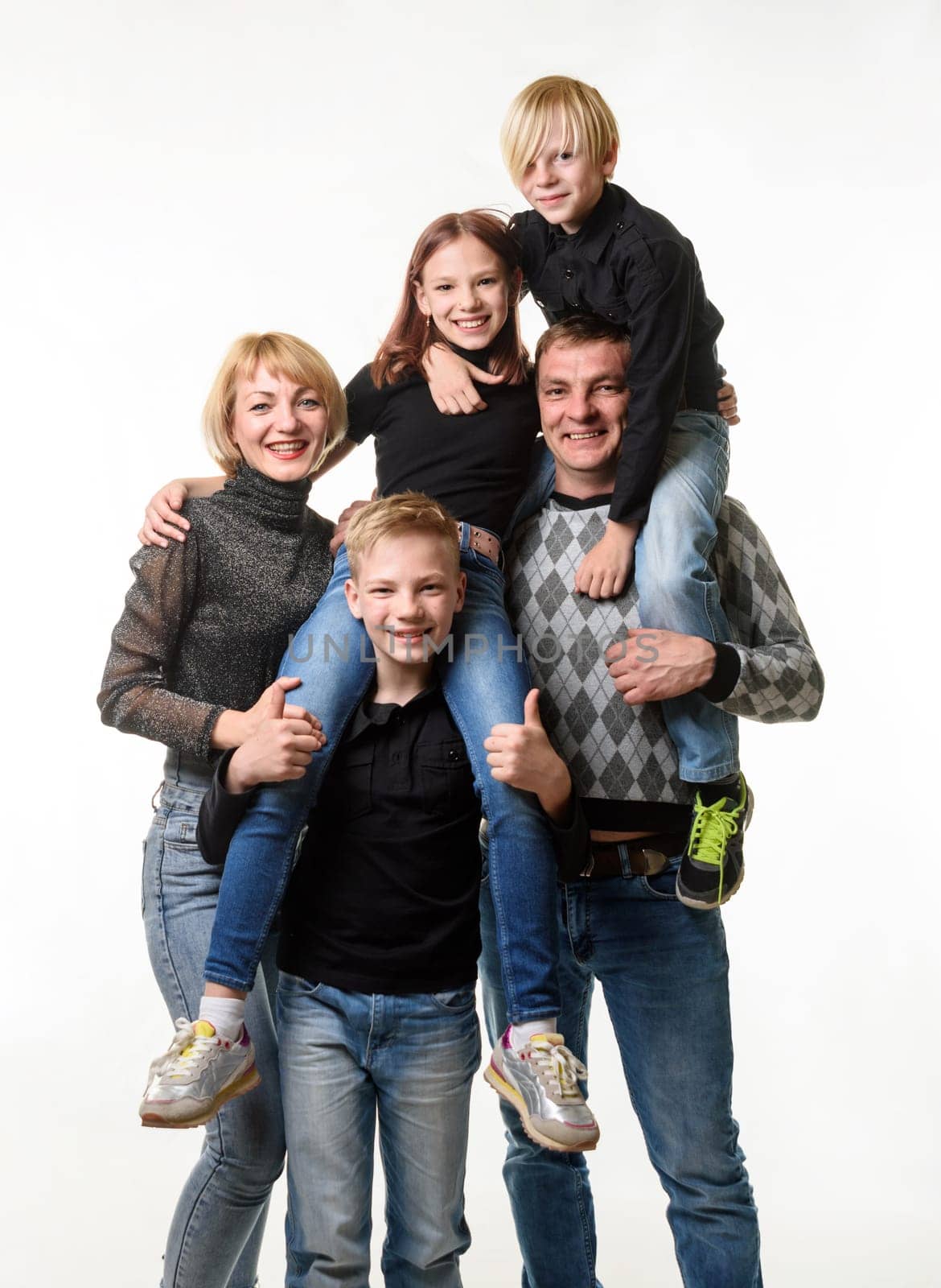 Portrait of a large family with teenagers in casual clothes on a white background