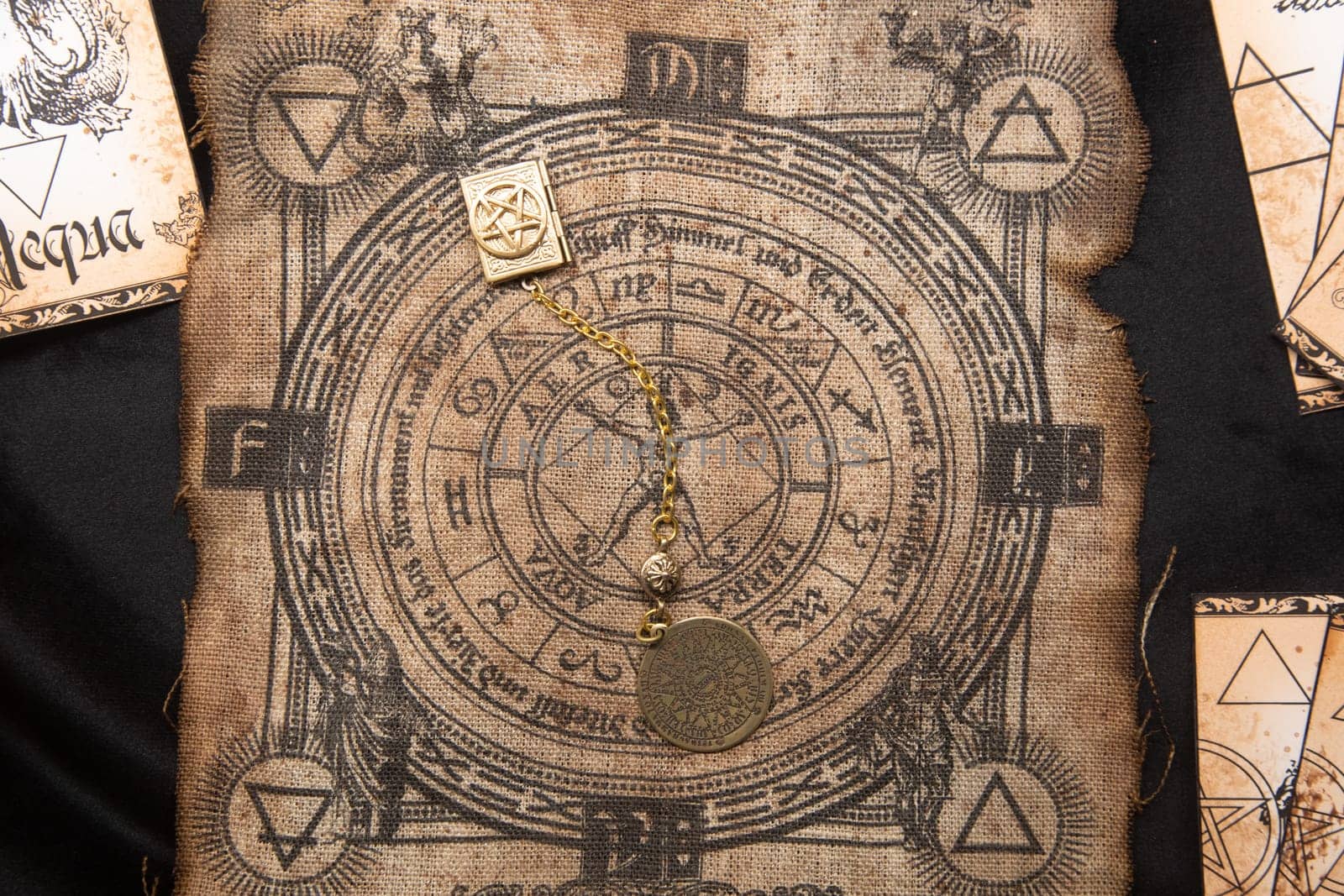Ancient esoteric witchcraft background. Occultims and paganism old symbol, with mysterious runes and alphabet.