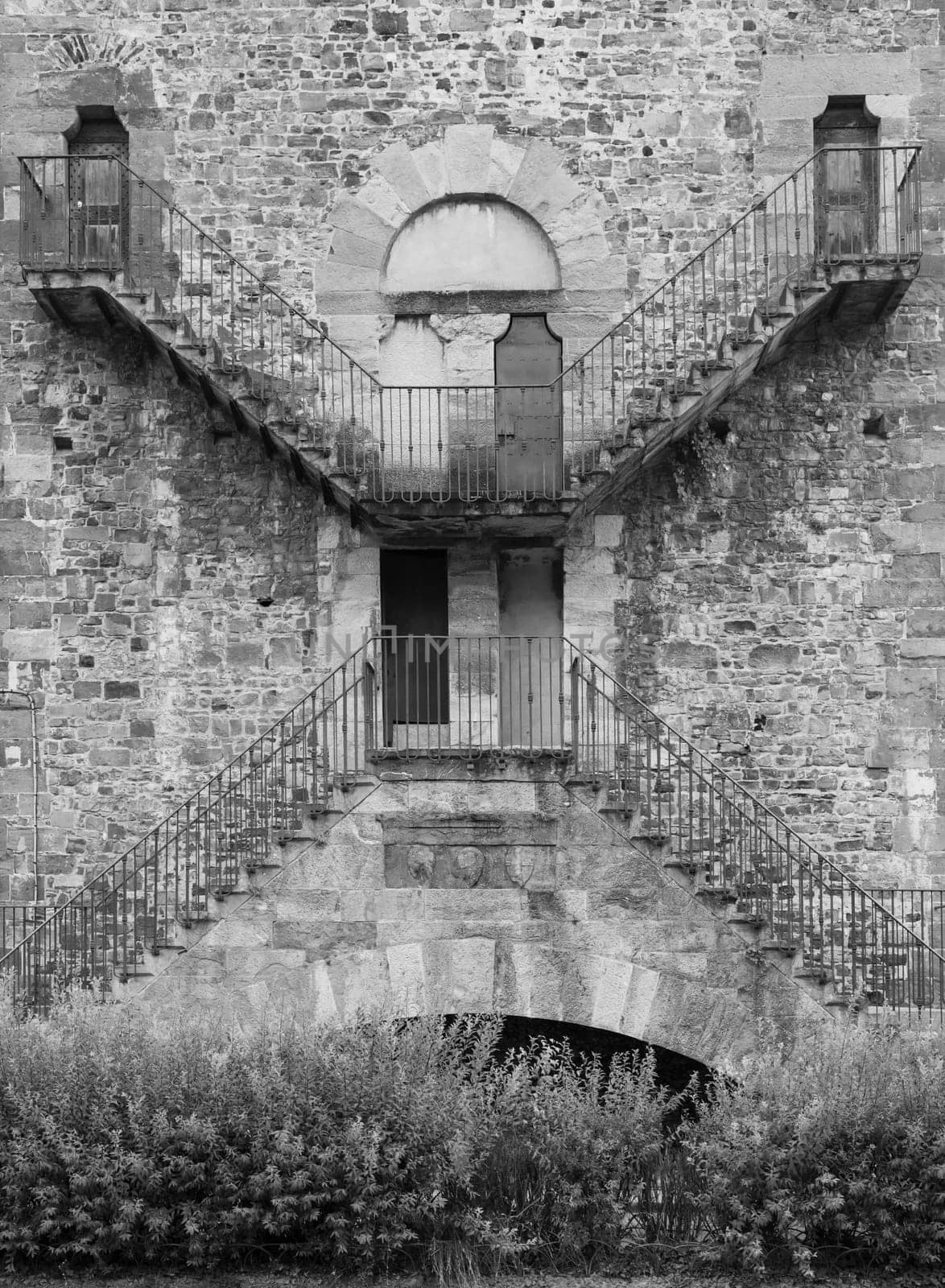Exterior of antique building with Escher architecture style. Simmetry and geometric perspective.