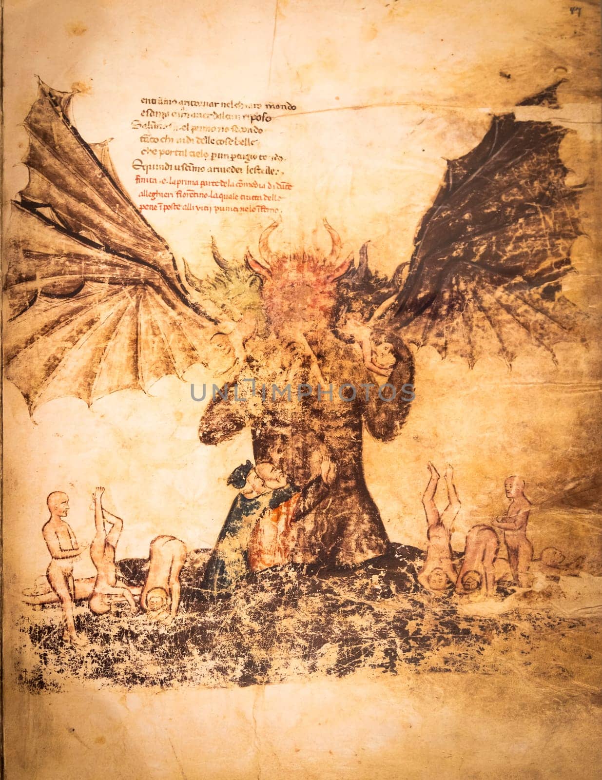FLORENCE, ITALY - circa July 2021. Antique manuscript sheet from a gothic book with satanic hell illustration, 16th Century copy.
