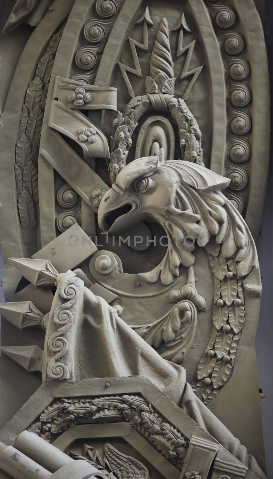 eagle on a heraldic shield, banners, laurel wreaths, a symbol of courage and valor of victory, a bas-relief