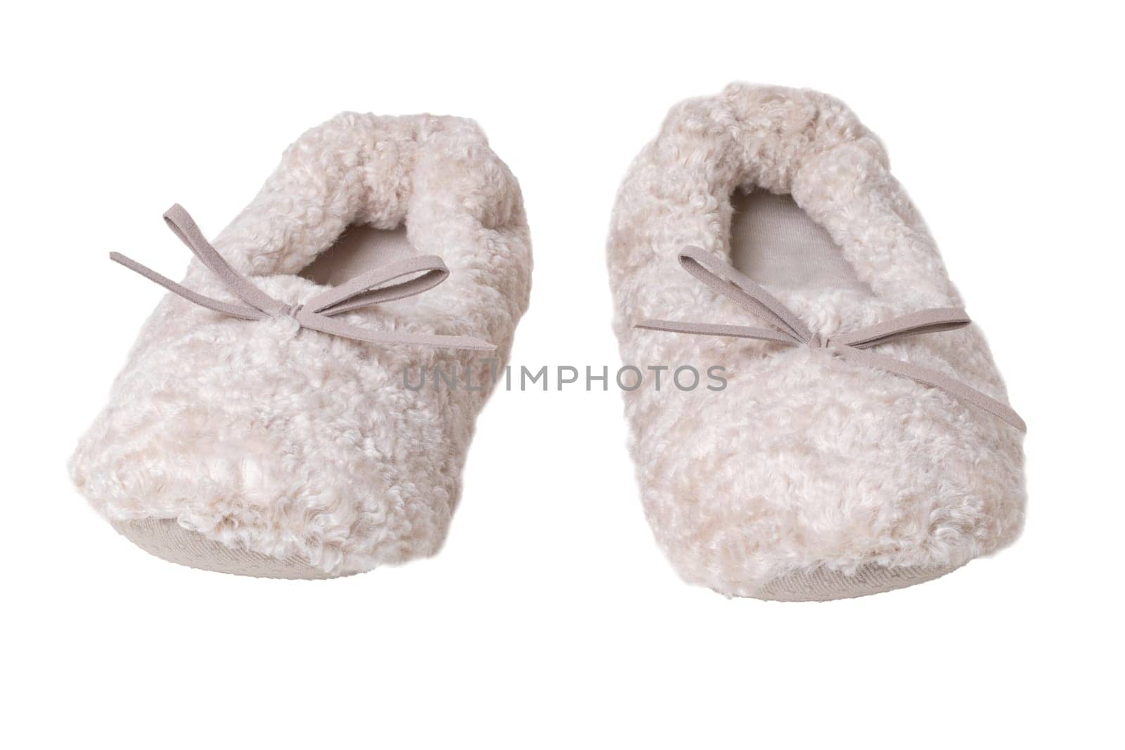 Slippers isolated. Close-up of a pair of female beige warm and soft cosy terry slippers isolated on white background.  Womans shoes.