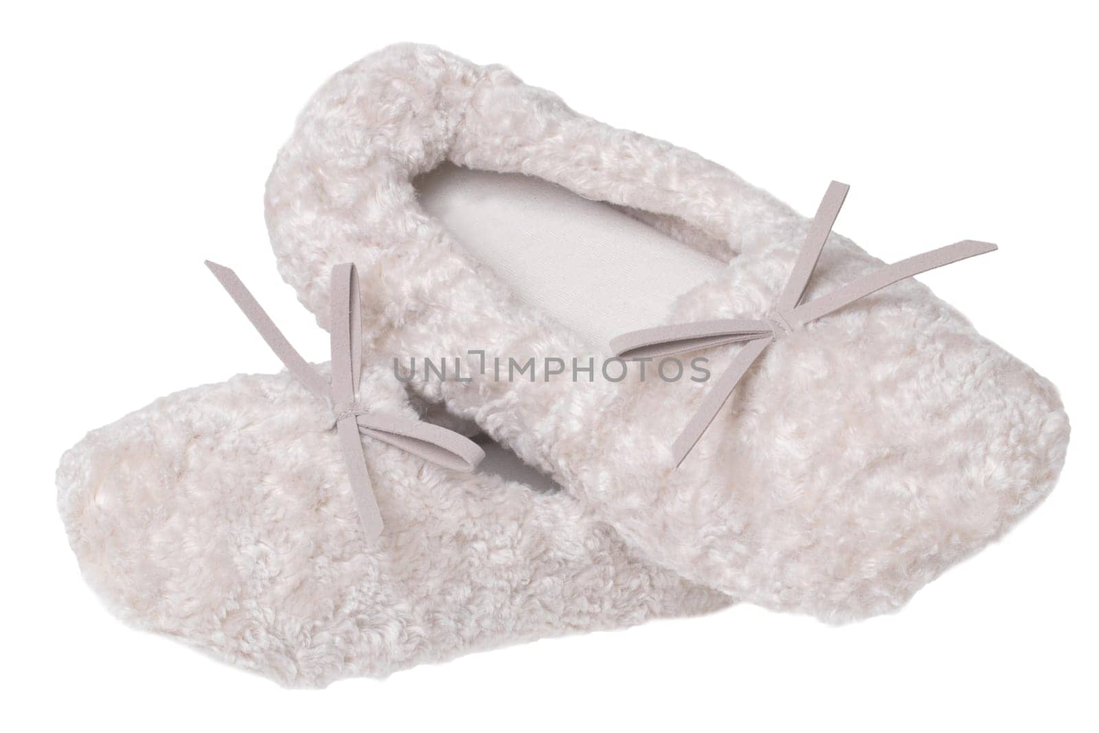 Slippers isolated. Close-up of a pair of female beige warm and soft cosy terry slippers isolated on white background.  Womans shoes.