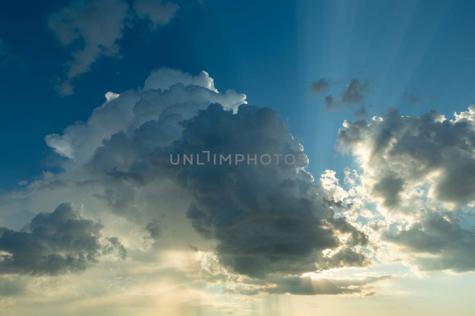 A landscape of clouds backlit by the sun, spring day