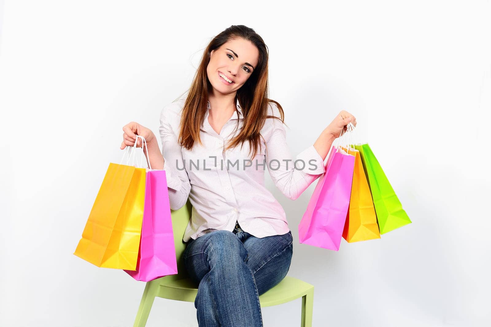 portrait young adult girl with colored bags