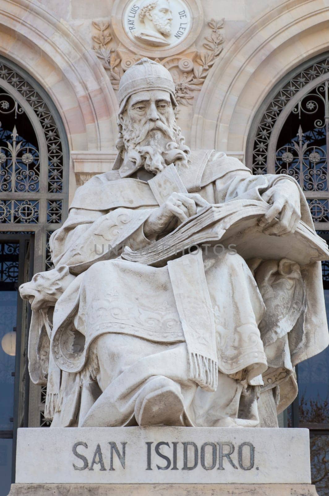 Madrid, Spain - March 6th, 2021: Isidore of Seville statue at National Library of Spain, Madrid. Medieval Spanish scholar