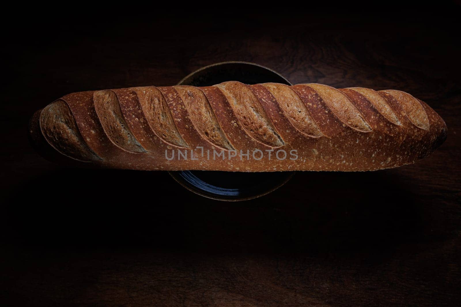 Homemade french bread baguette on wooden backround