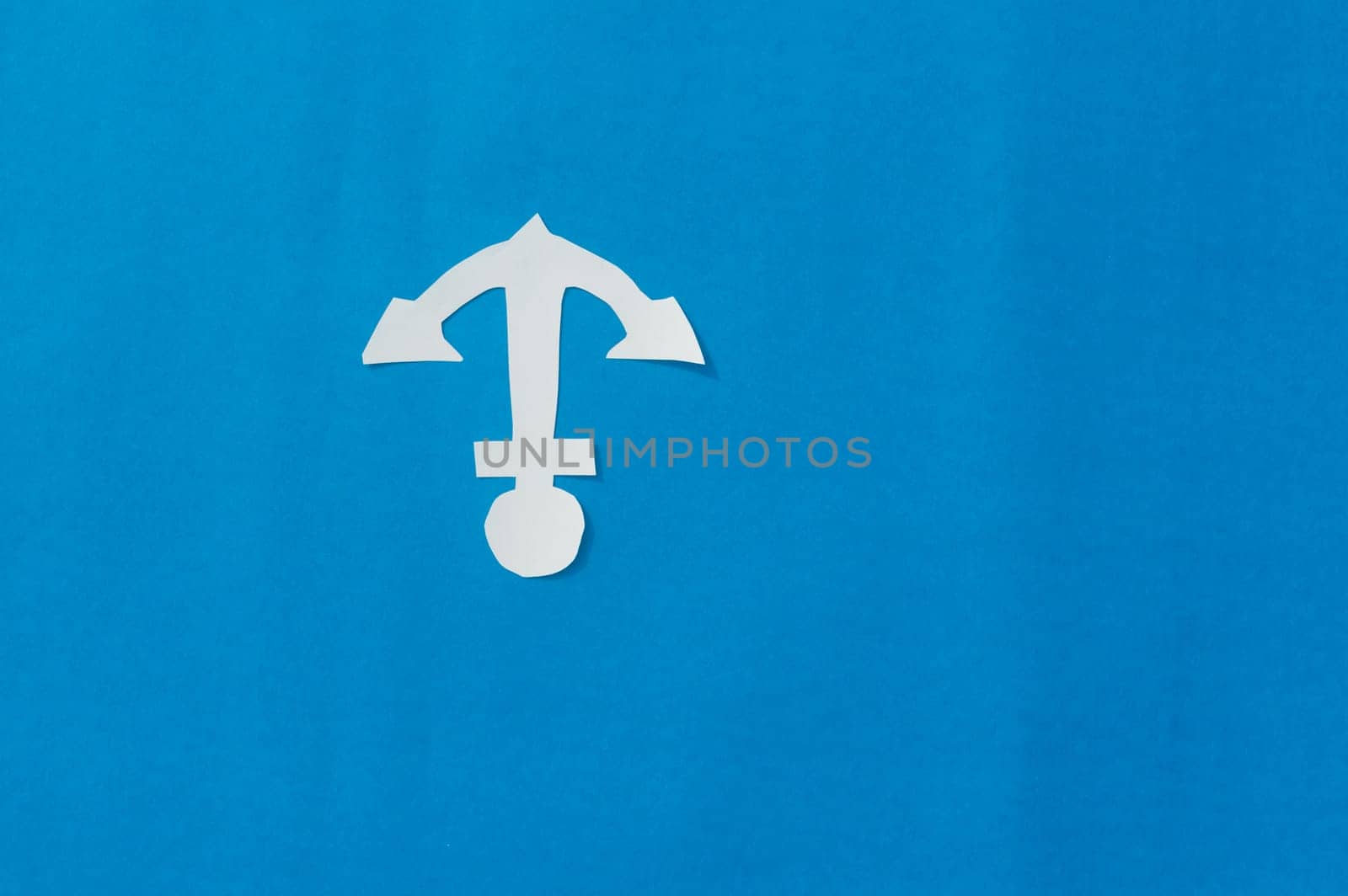 White Anchor on Isolated Blue background. Nautical theme. Copy Space.