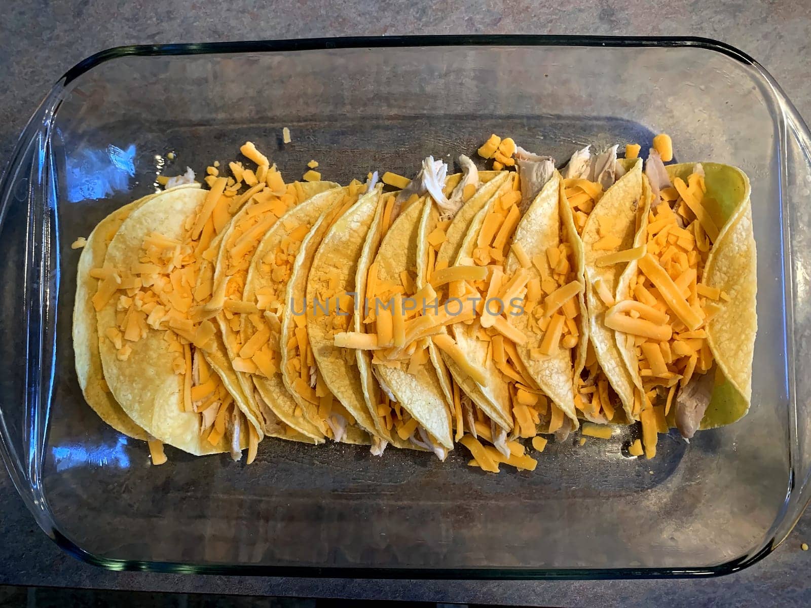 Chicken enchiladas in red chile sauce preparation