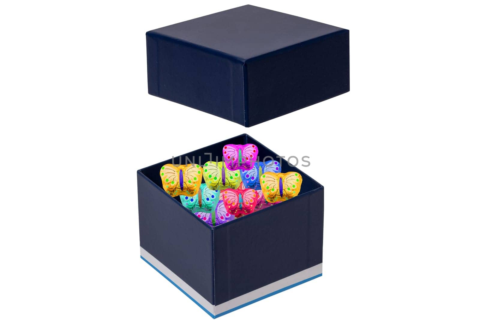 Gift box isolated. Close-up of a blue opened present or gift box with colourful sweets on a white background. Birthday, Valentine's Day, anniversary or other holiday. Macro.