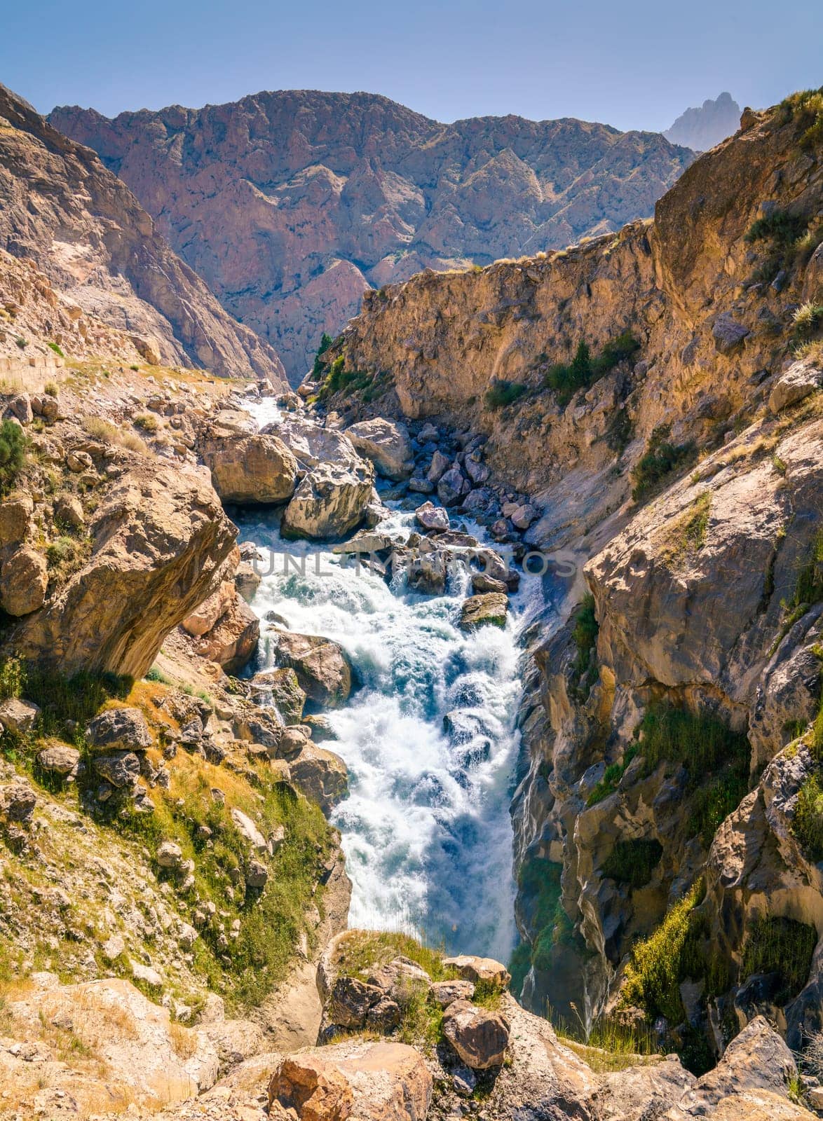 Fast mountain river in the Zarafshan Mountain Range in Tajikistan