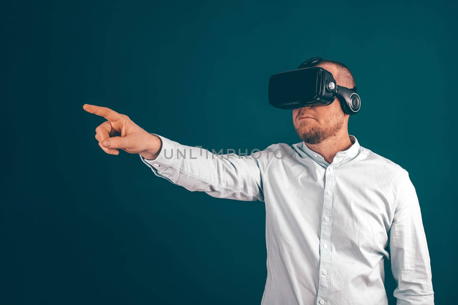 Metaverse digital cyber world technology. Businessman with VR glasses using AR augmented reality NFT, futuristic lifestyle concept