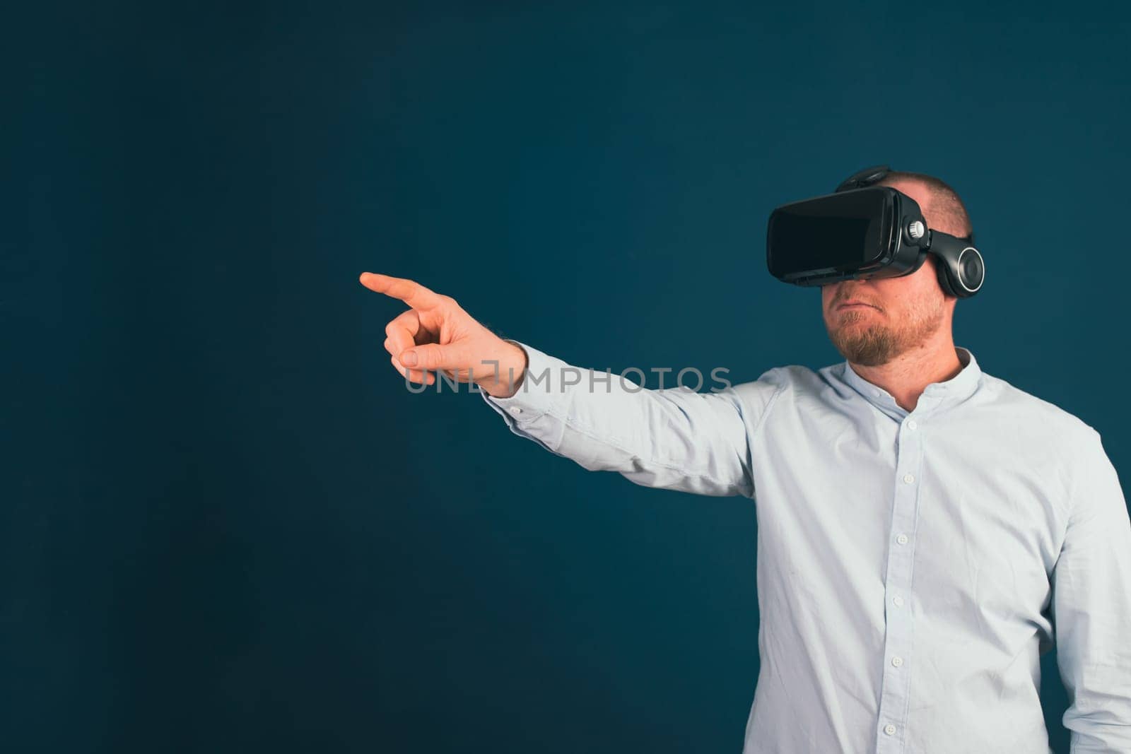 Metaverse digital cyber world technology. Businessman with VR glasses using AR augmented reality NFT, futuristic lifestyle concept