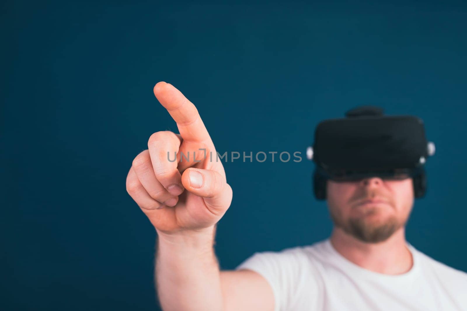 Metaverse digital cyber world technology. Man with VR glasses using AR augmented reality entertainment. NFT, game, futuristic lifestyle.