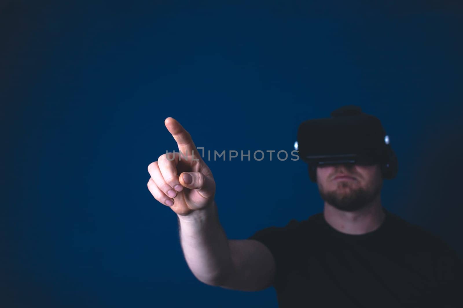 Metaverse digital cyber world technology. Man with VR glasses using AR augmented reality entertainment. NFT, game, futuristic lifestyle.