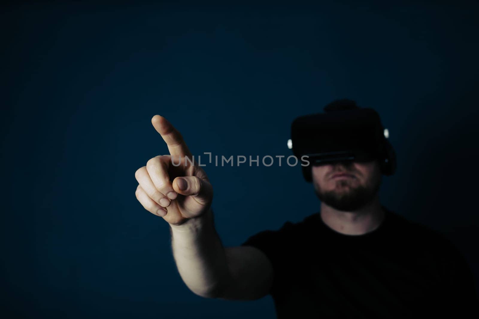 Metaverse digital cyber world technology. Man with VR glasses using AR augmented reality entertainment. NFT, game, futuristic lifestyle.