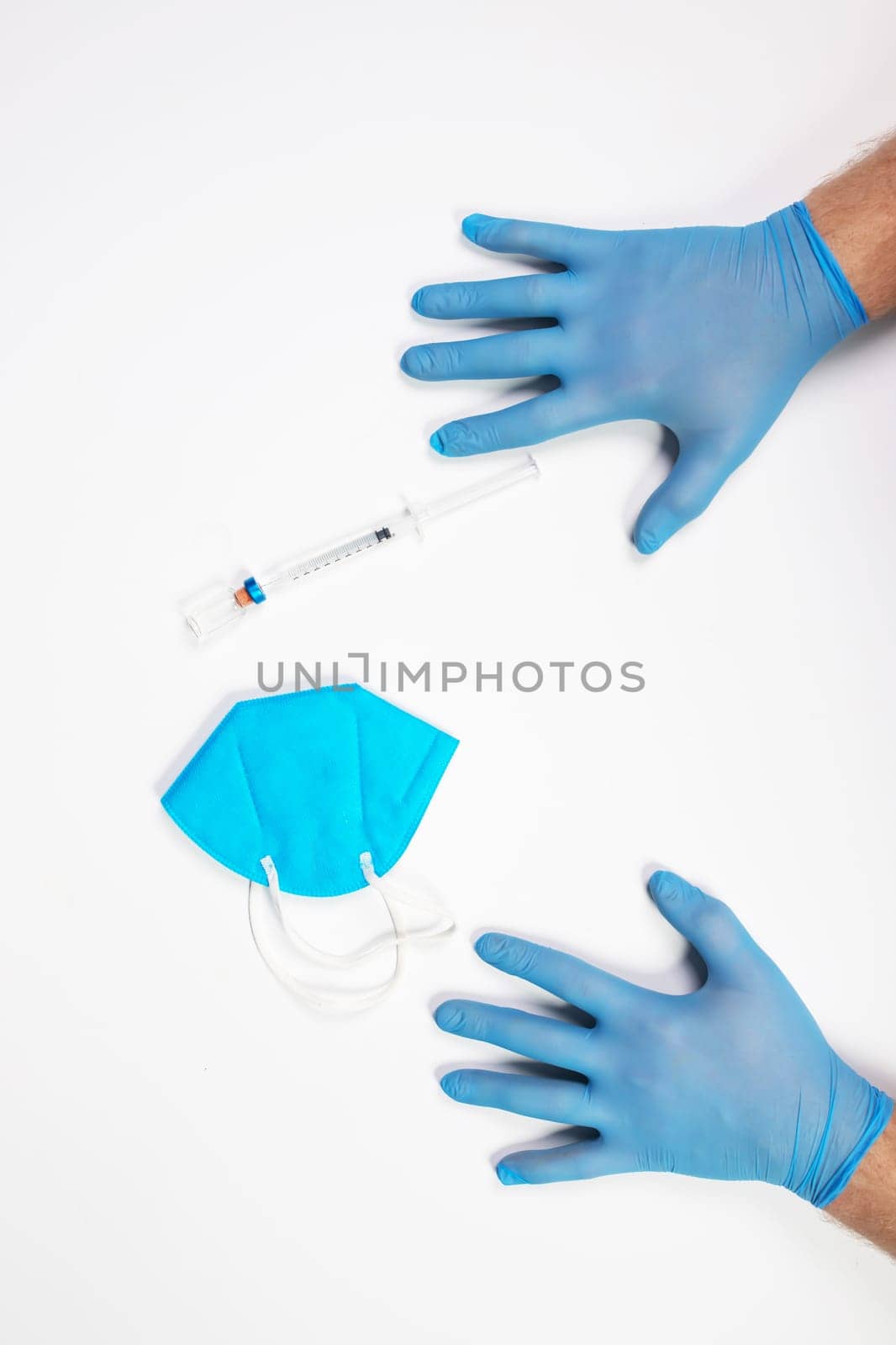 Flat lay of vaccine, test and medical mask. The concept of prevention during Coronavirus pandemic.
