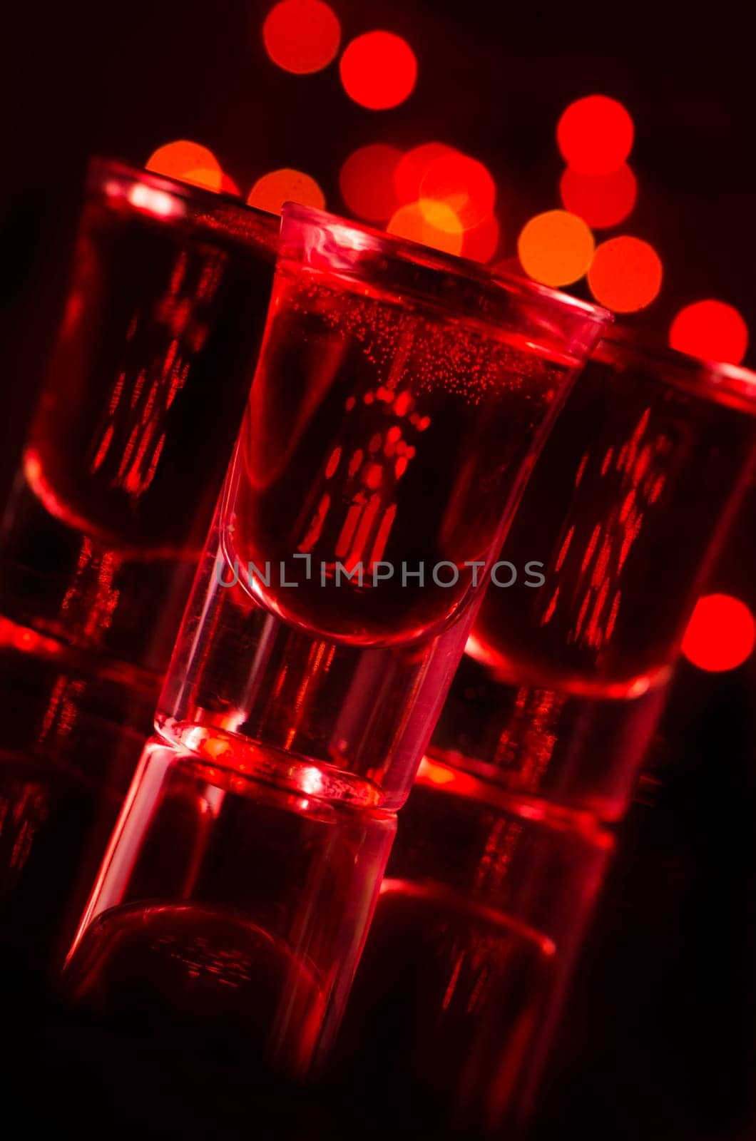 Red cocktail in shot glasses
