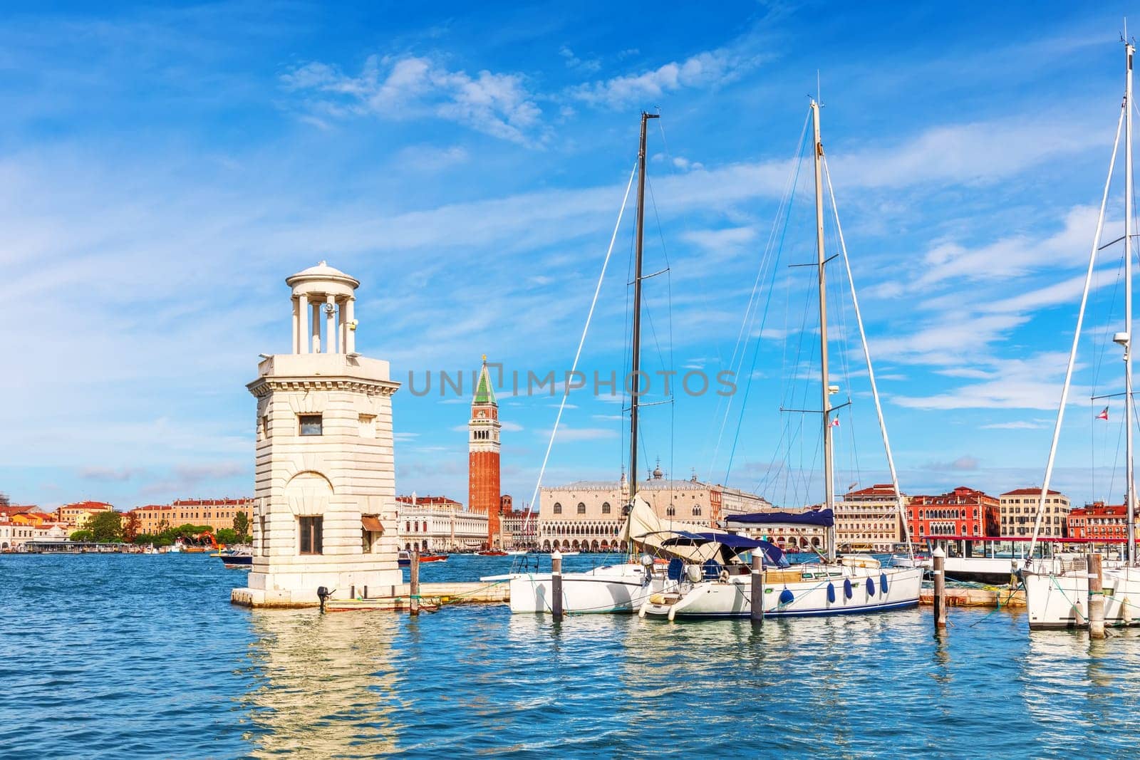 Lagoon of Venice, lighthouse and boats, beautiful italian view.