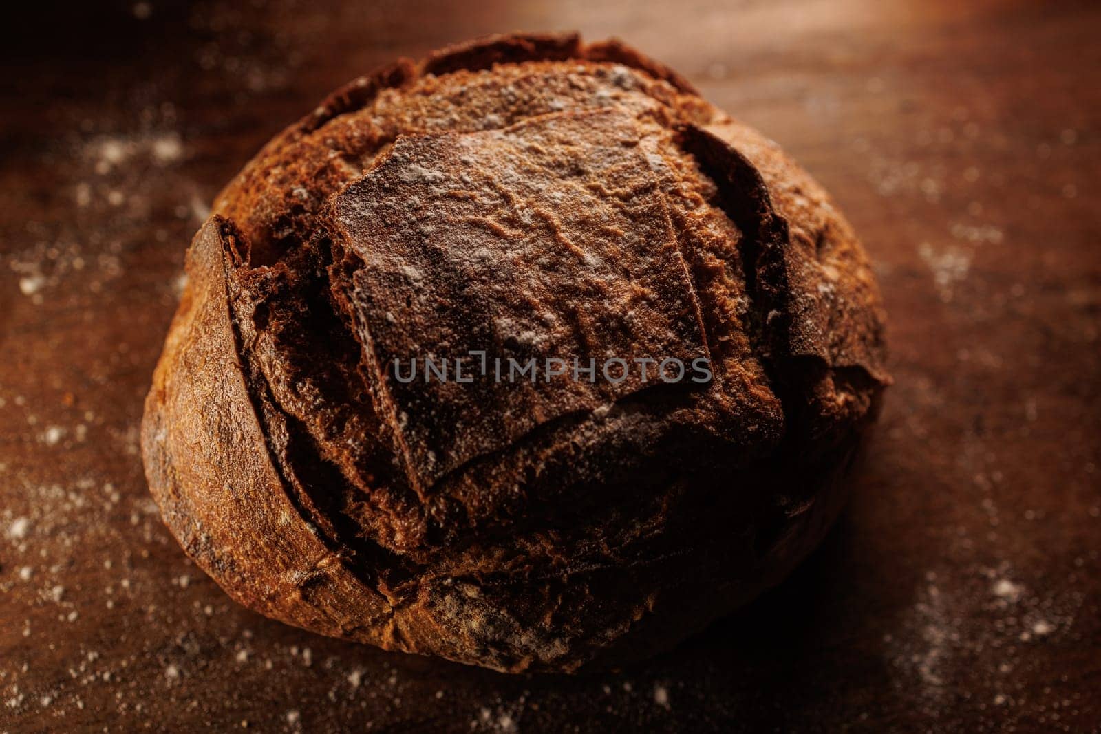 freshly baked bread on wooden table with loaf details