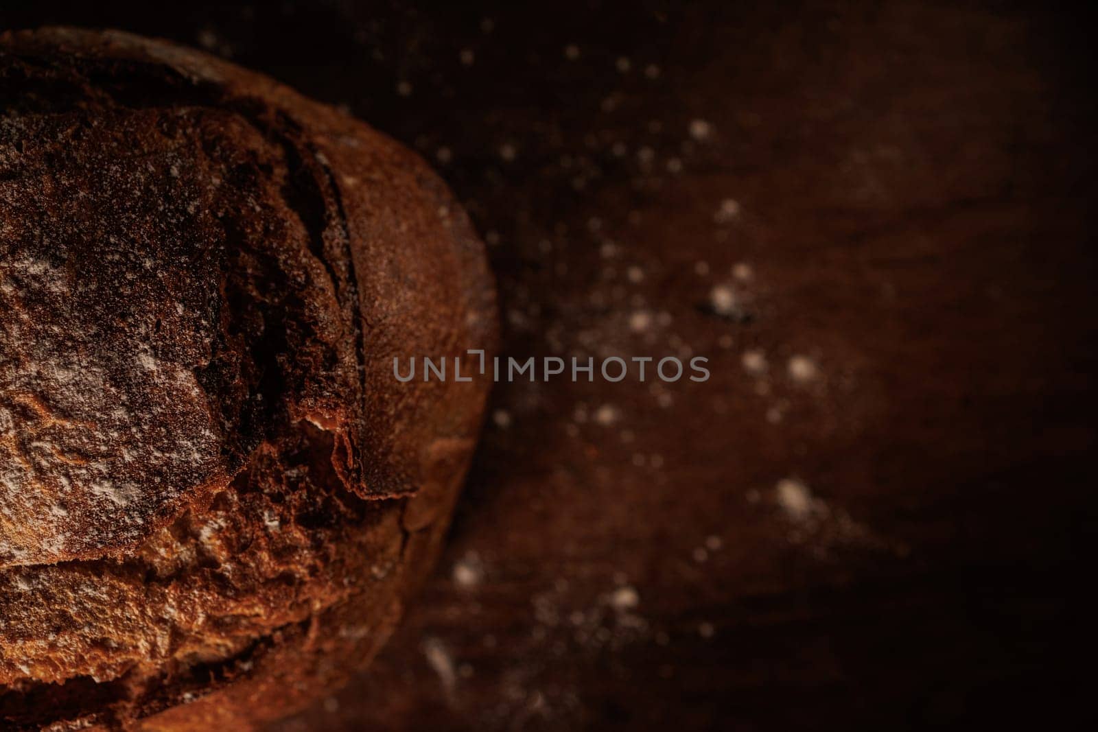 freshly baked bread on wooden table with loaf details