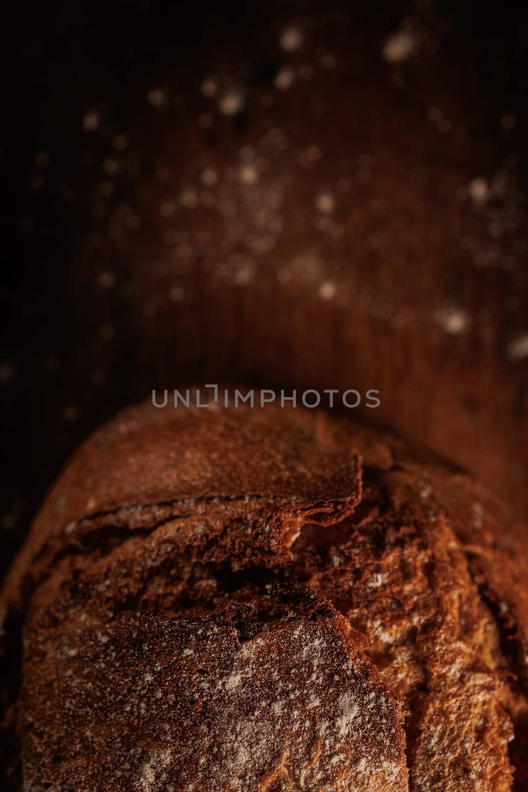freshly baked bread on wooden table with loaf details