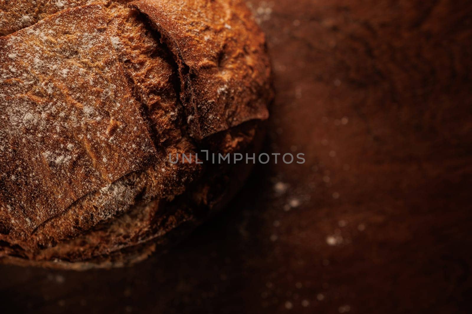 freshly baked bread on wooden table with loaf details