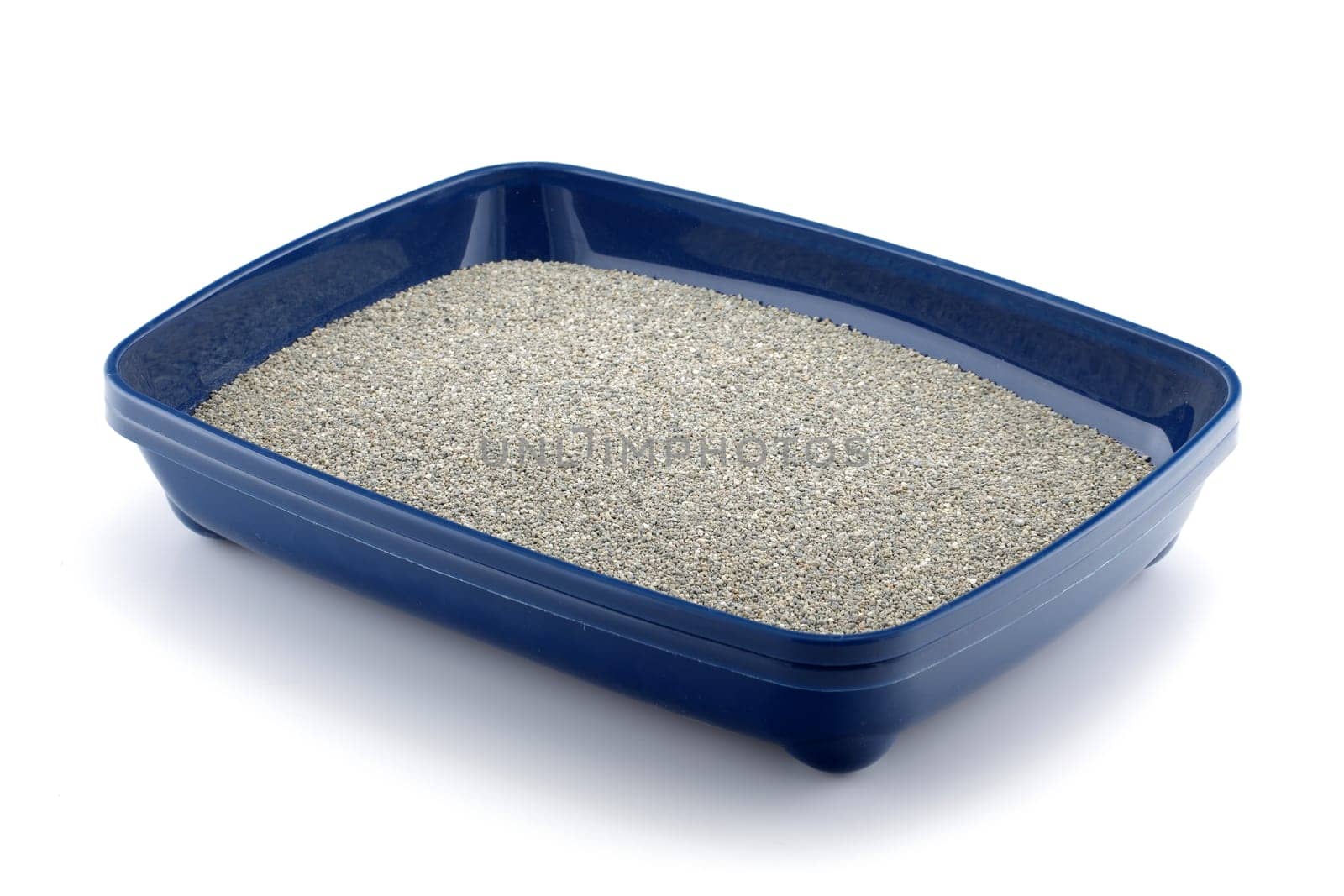 Blue cat litter tray with clumping litter isolated on white
