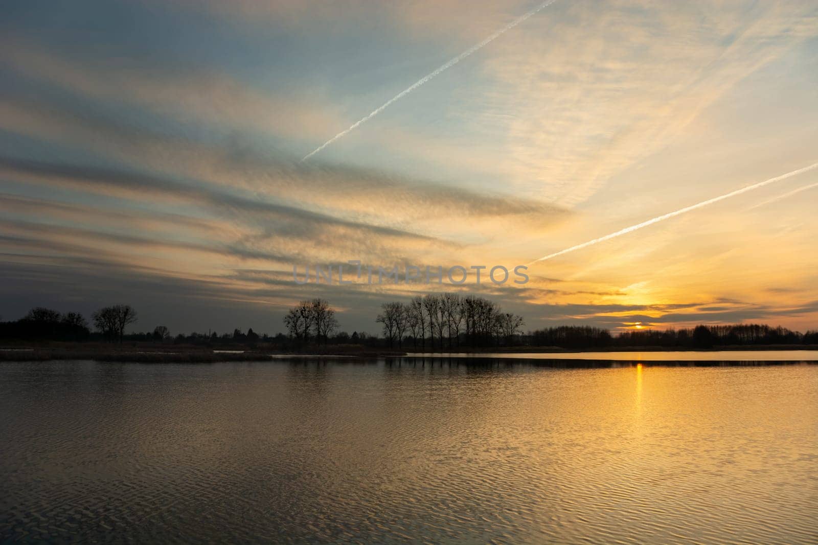 Beautiful sunset and clouds over the lake, Stankow, Poland