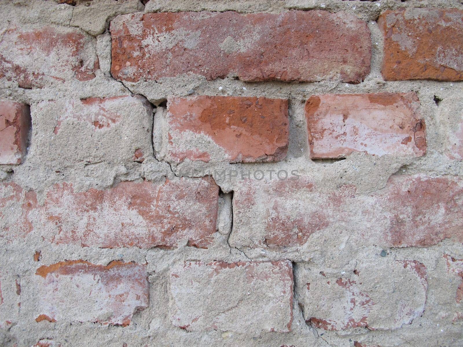 Brick masonry freed from plaster, unplastered house brick wall without wall plastering
