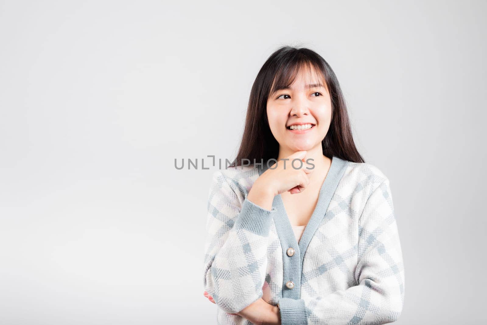 Happy woman hand touch chin handle relaxed thinking about something about the question, Portrait Asian beautiful young female idea think studio shot isolated on white background with copy space