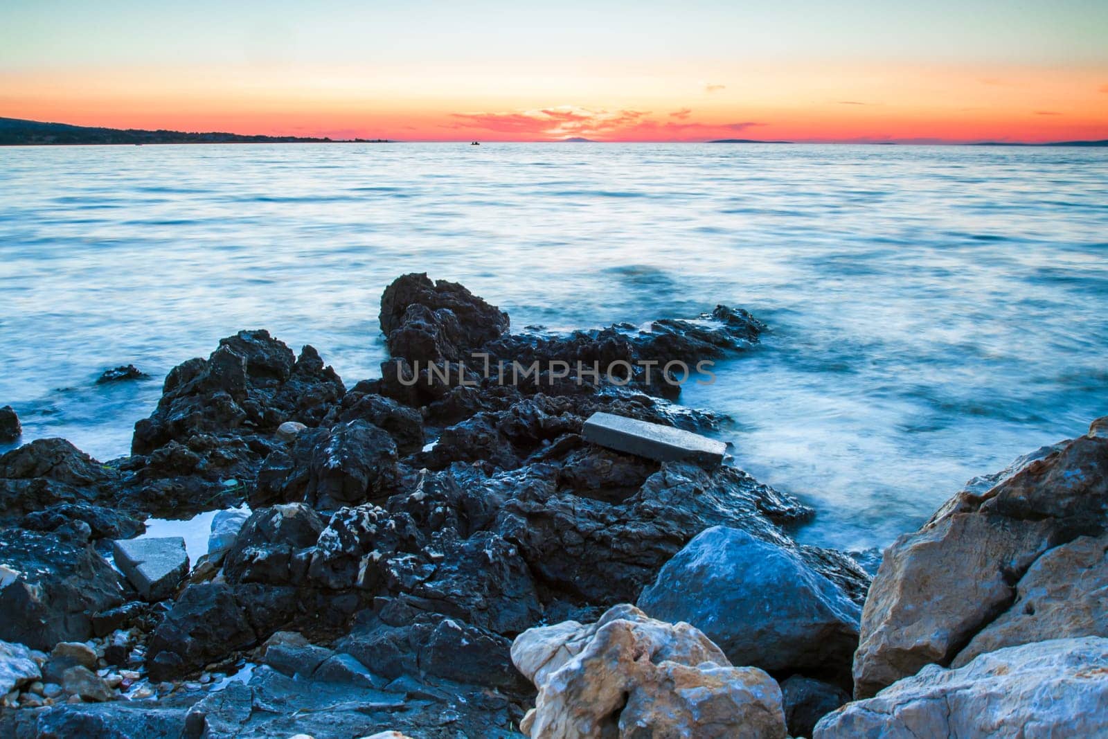 Rocky coastline and blue sky on island Vir, Croatia. Evening sunset with pastel colours of sky.