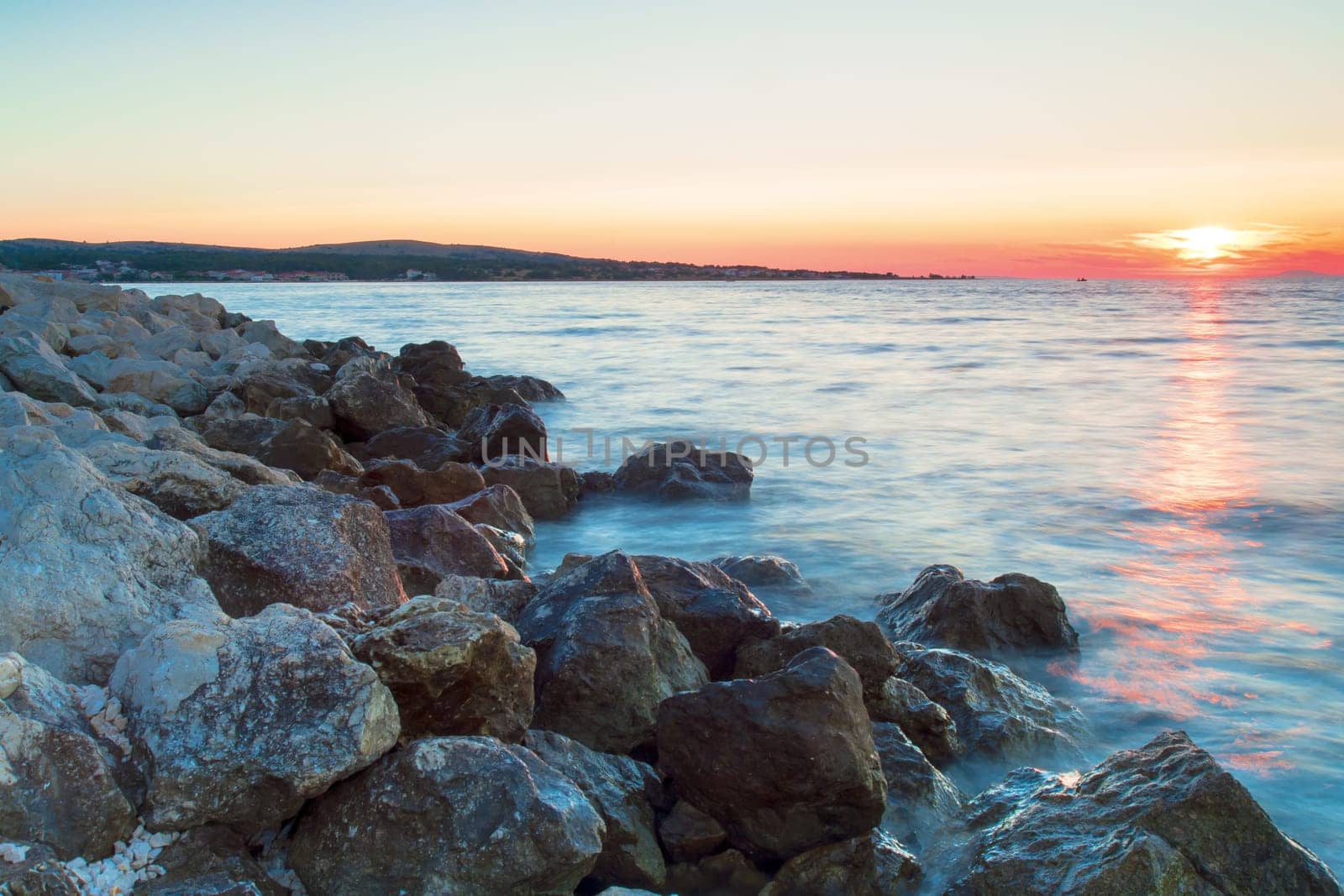Rocky coastline and blue sky on island Vir, Croatia. Evening sunset with pastel colours of sky.