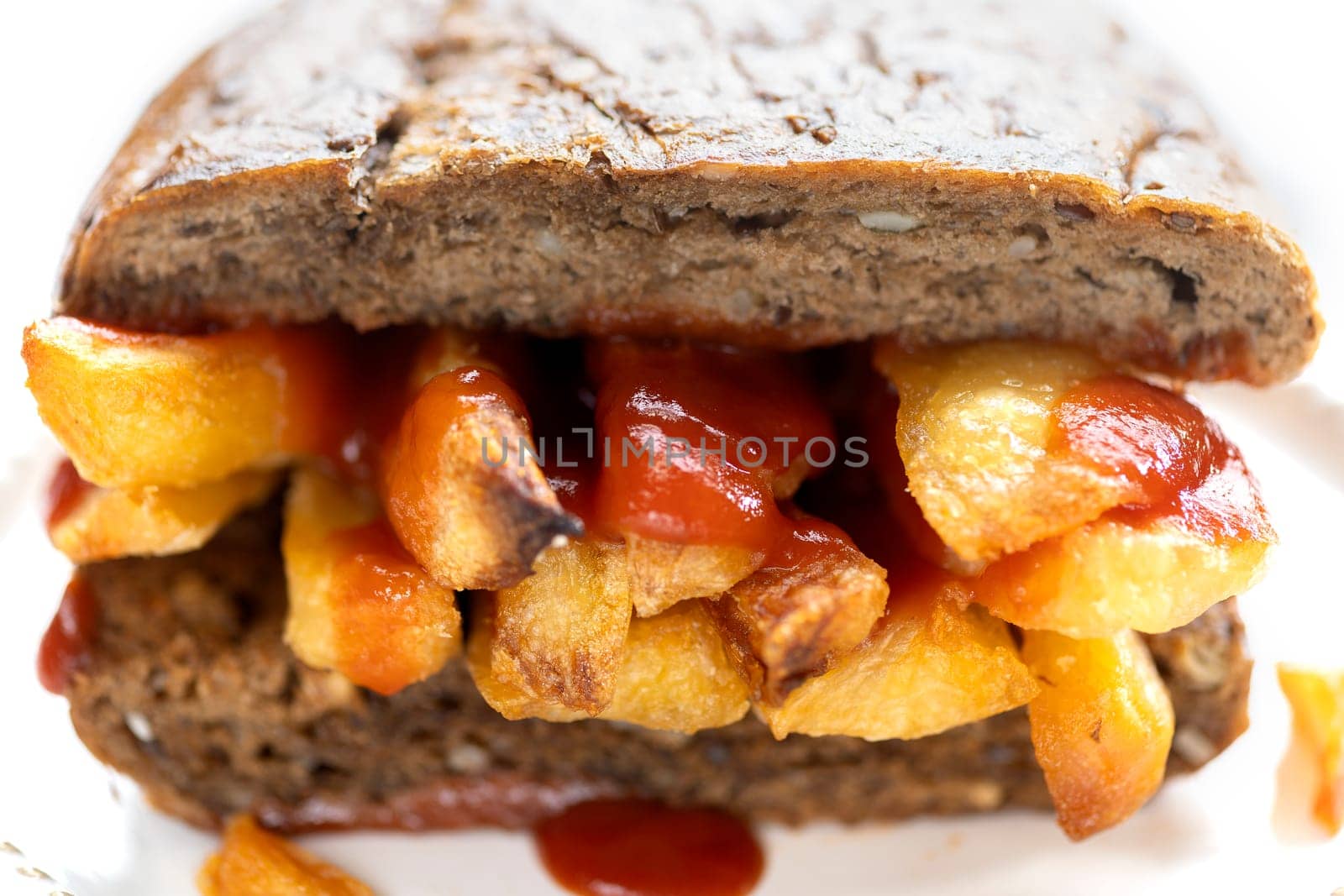 close up of traditional british chip butty sandwich