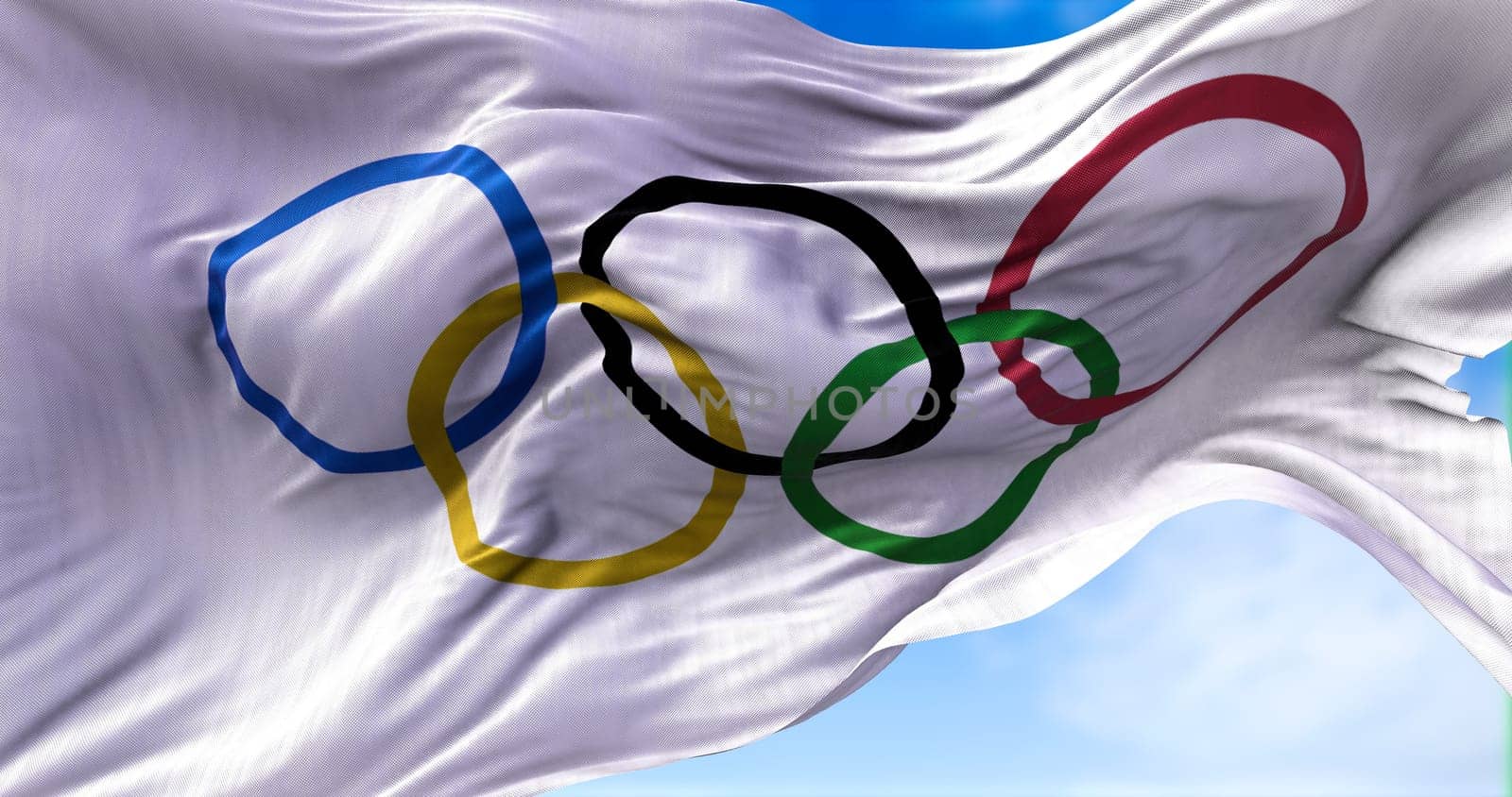 Baijing, CHN, february 2022: white flag with the five Olympic rings flapping in the wind. Olympics are leading international sporting events featuring summer and winter sports
