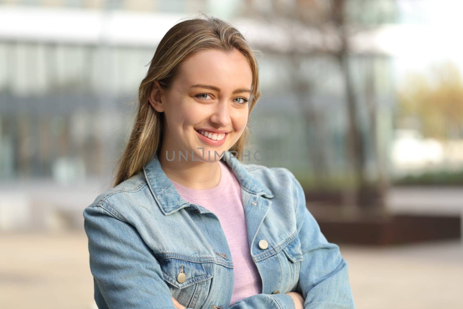 Happy teen posing looking at camera standing in the street