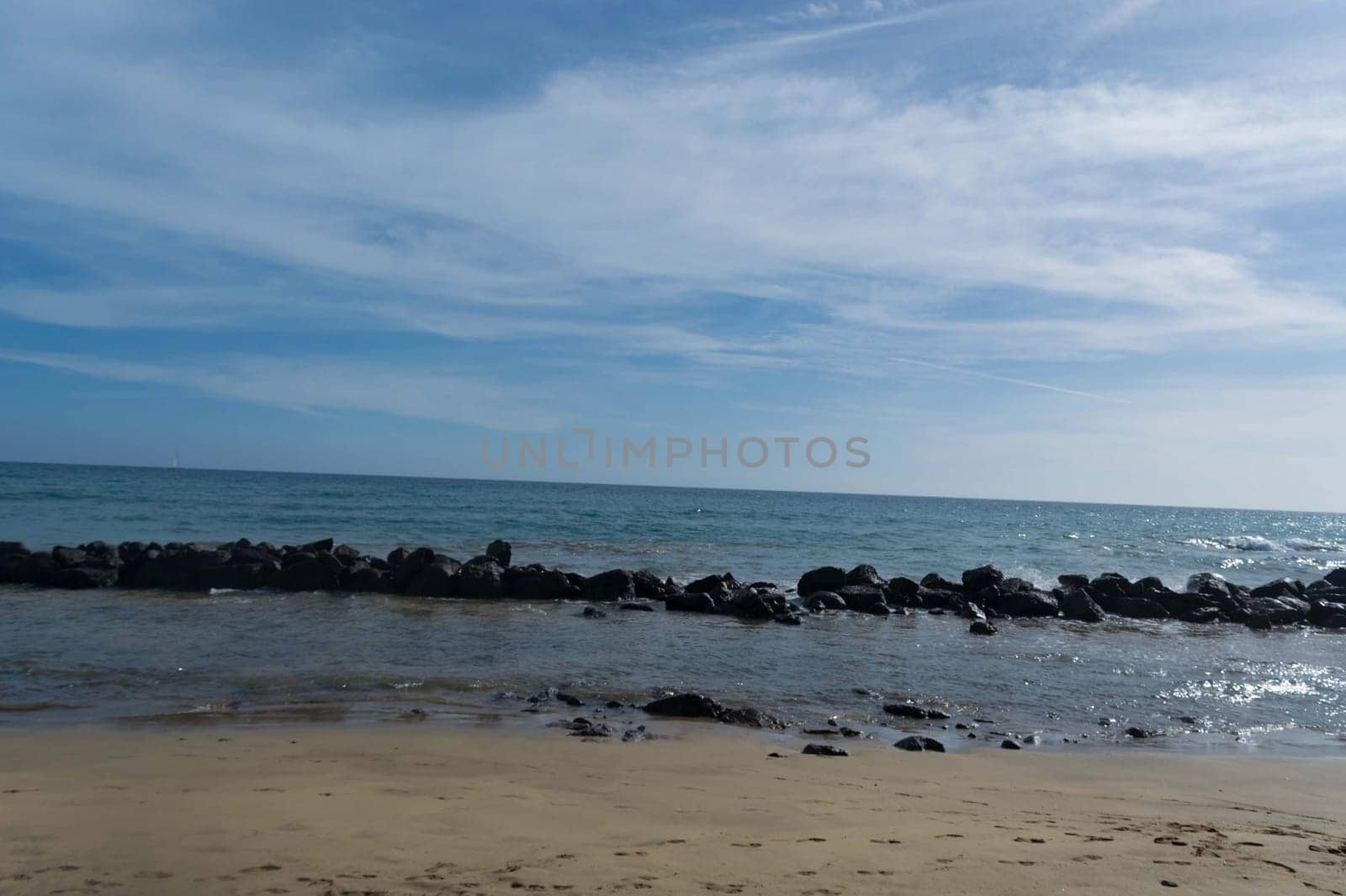 Beach of Gran Canaria in Meloneras, beach near lighthouse.