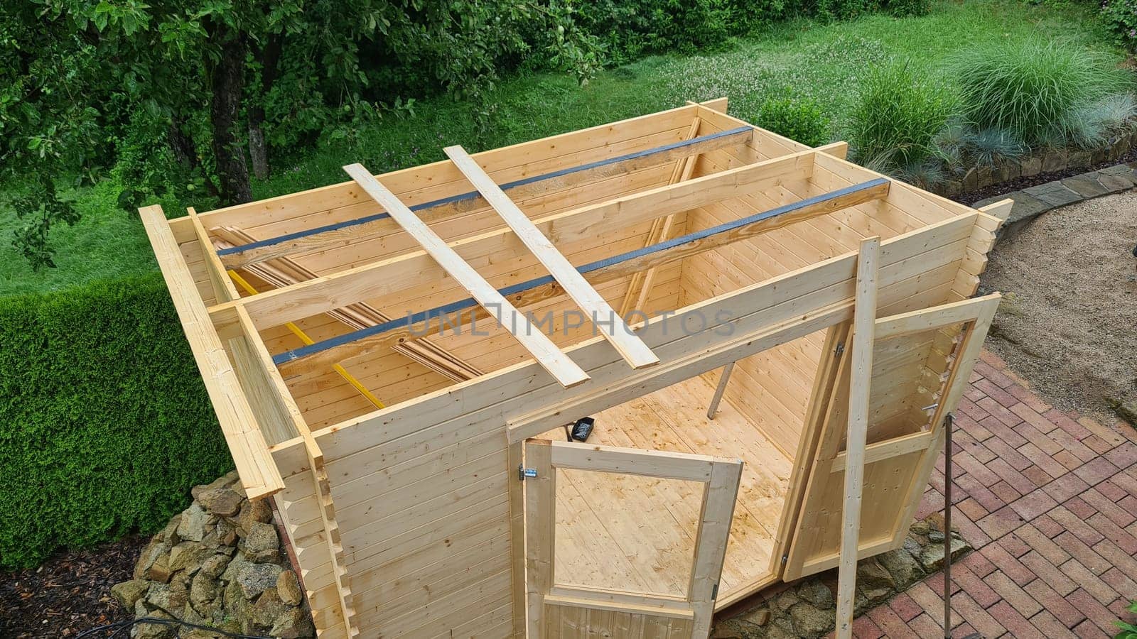 Garden shed built from tree trunks