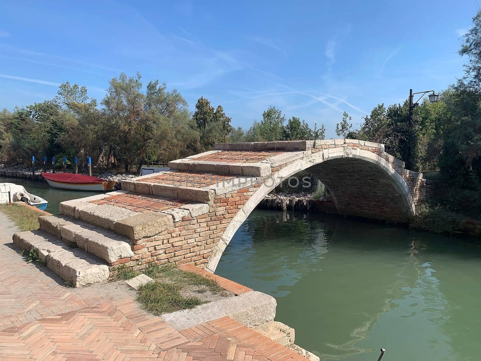Devil's Bridge at Torcello island at the northern end of Venetian lagoon, Venice, Italy. Torcello was first settled in the year of 452