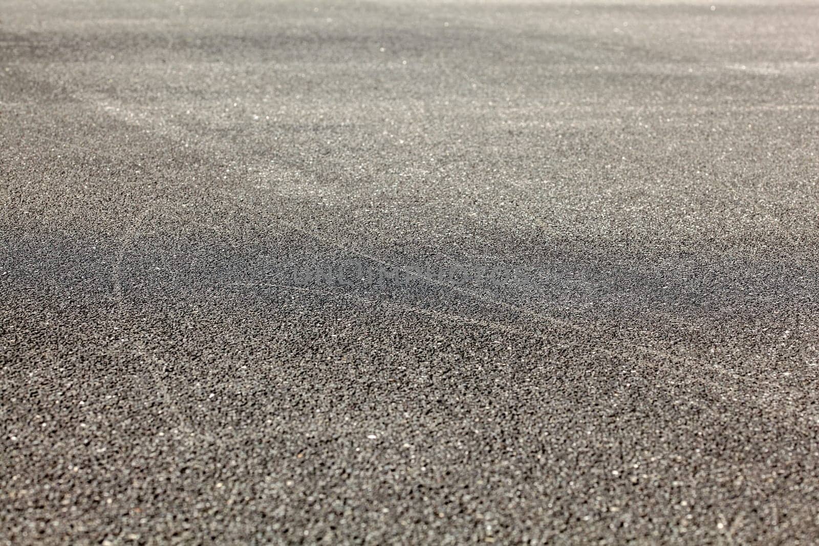 Detail of asphalt road from low angle. Abstract urban background.