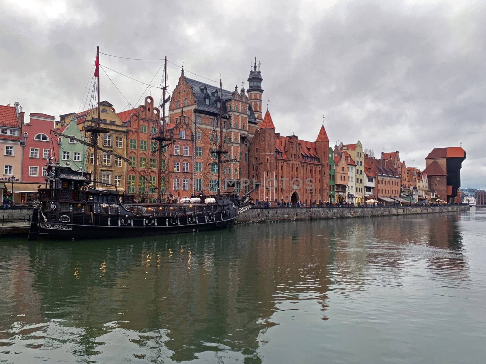 Dramatic picture of the historical buildings of Gdansk on the cold Nowa Motlawa channel in Poland