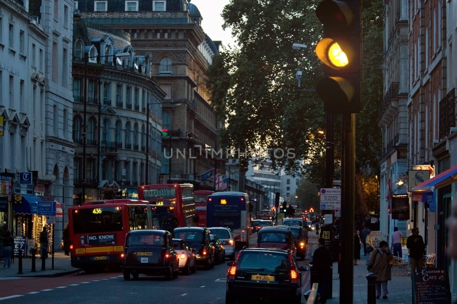 London, United Kingdom - November 18th, 2006: Typical afternoon traffic in UK capital, heavy but not hold up. Mostly taxis and buses driving, cars must pay congestion charge to drive in central zone.